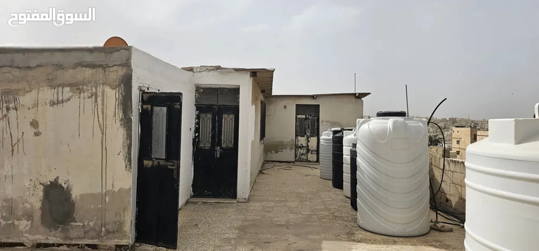 عماره للبيع في الزرقاء حي الإسكان