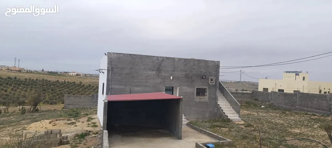 ارض مع بيت