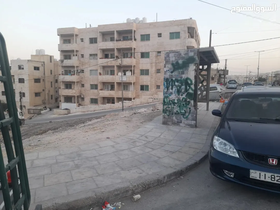 ارض تجاري مقابل مسجد الفلاح على 3 شوارع عالشارع الرئيسي